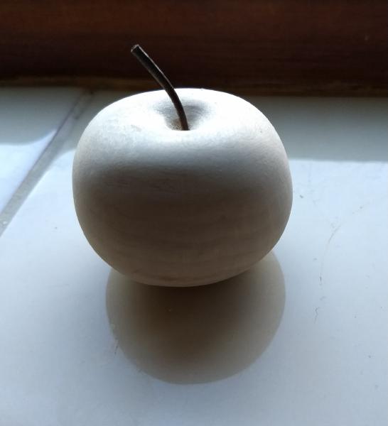 Unpainted apple with leather stalk
